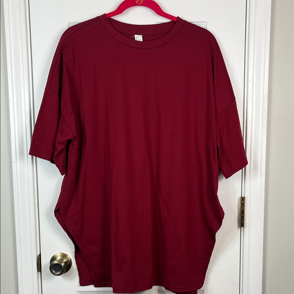 NWT Floerns burgundy short sleeved tee shirt size large. Has cut outs on sides.